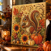 A framed painting featuring a detailed, textured image of a squirrel surrounded by autumn leaves and pumpkins.