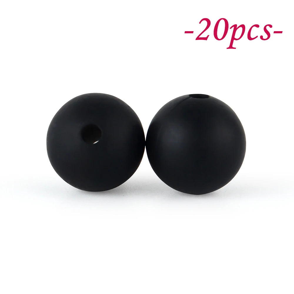 Two black silicone beads are shown against a white background.