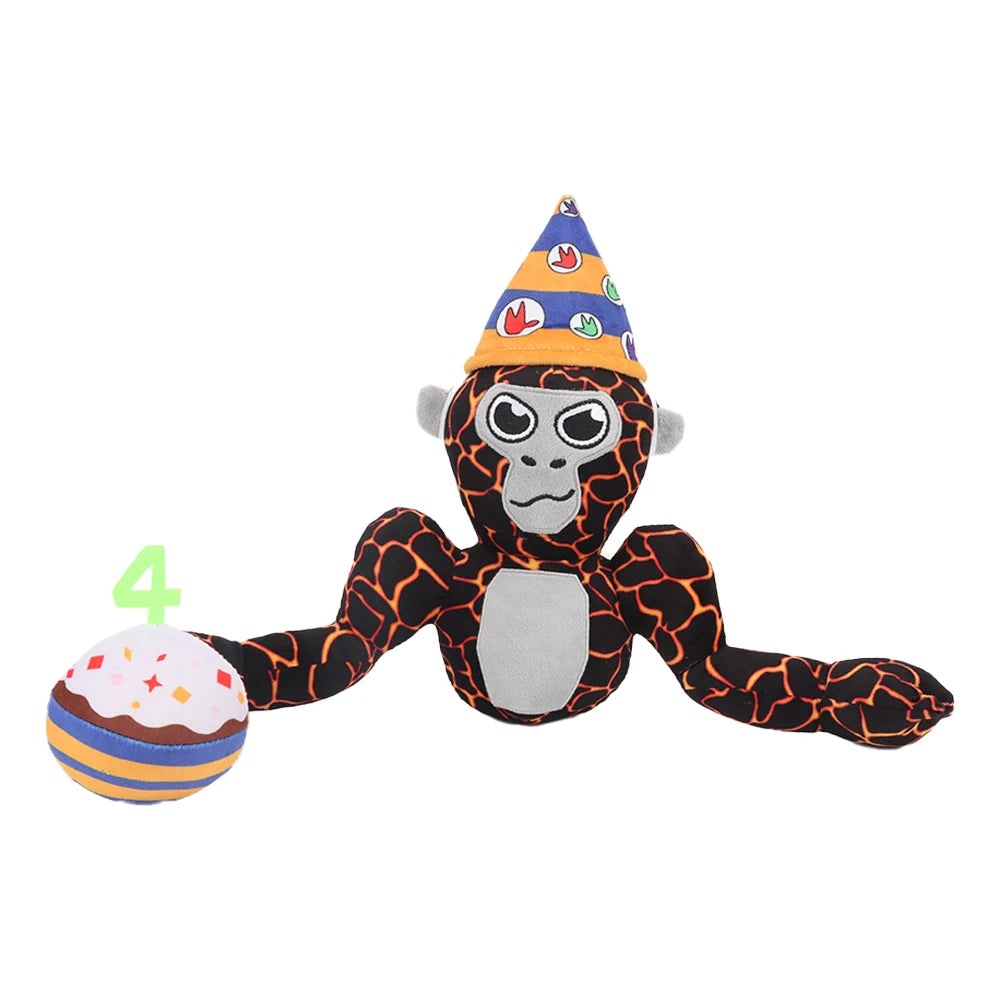 A black and gray gorilla plush toy wearing a party cone hat with colorful decorations.
