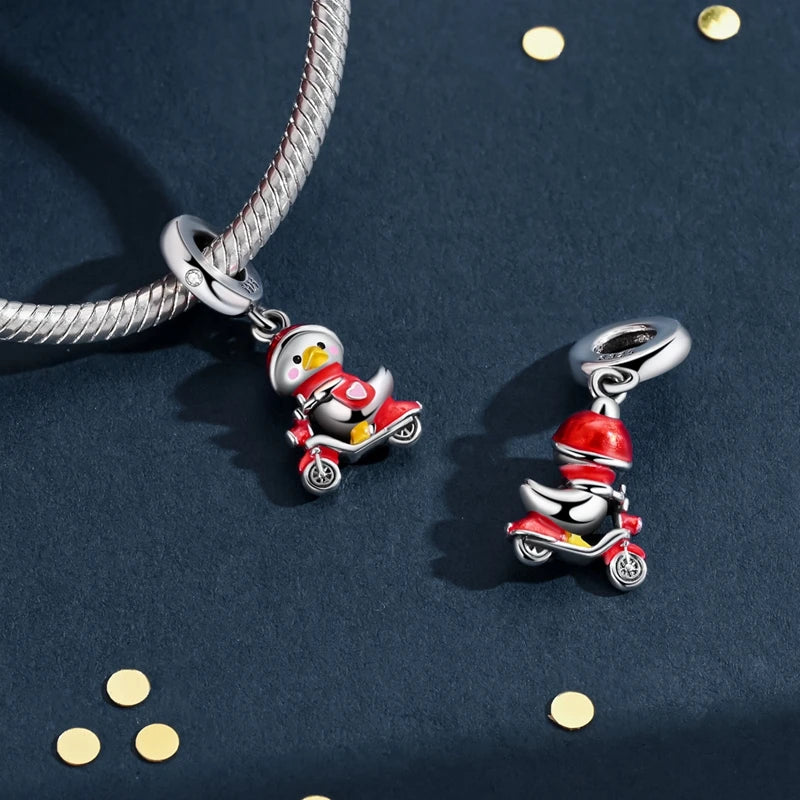 Sterling silver charm bead pendant featuring a red and yellow motorcycle character on a silver chain.