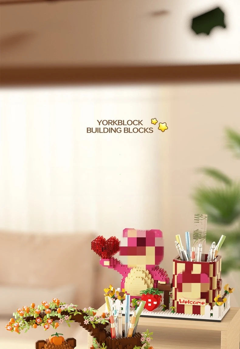 A set of building blocks and a pen holder organizer featuring a pink capybara character.