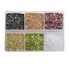 A clear plastic tray filled with various colors of crushed glass stones for resin and craft projects.