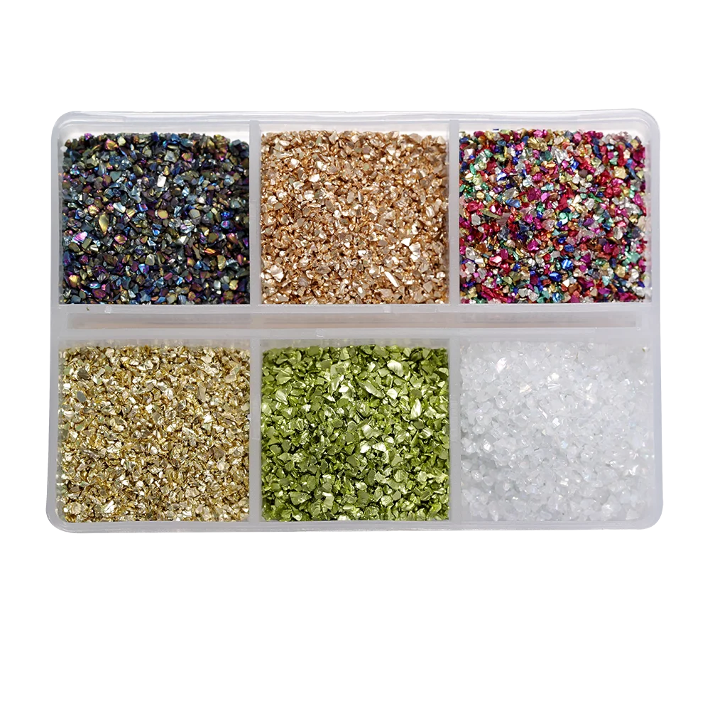 A clear plastic tray filled with various colors of crushed glass stones for resin and craft projects.