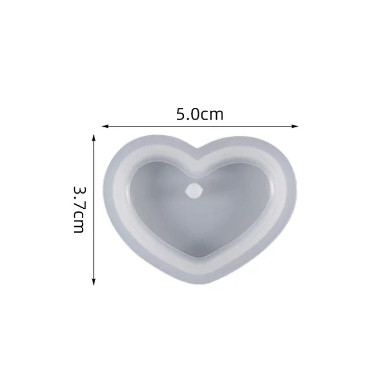 A heart-shaped silicone mold with dimensions 5.0cm by 3.7cm for resin jewelry making.