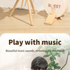 A wooden kids drum set with sticks is shown next to a text promoting playing with music and embellishing childhood.