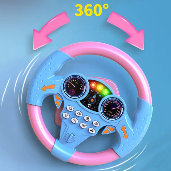 A pink and blue 360 degree rotation educational steering wheel for toddlers shown in a studio setting.