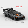 A black classic supercar model built from LEGO bricks, shown in a side view.