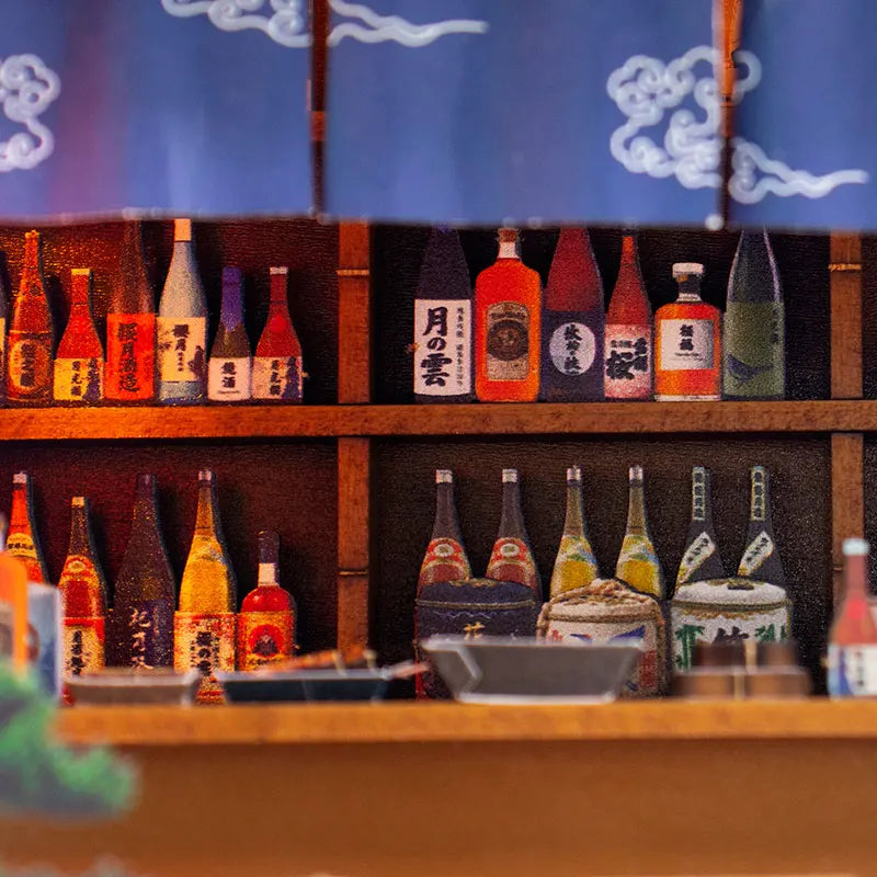 A wooden miniature Japanese restaurant dollhouse kit with various bottles and decorative items displayed on shelves.