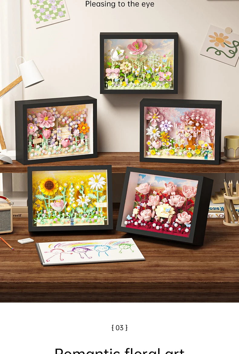 A display of various floral art paintings and a set of 3D flower building blocks for a DIY craft kit.