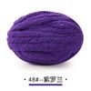 Purple chunky chenille yarn ball for hand knitting projects