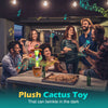 A group of people interacting with a plush cactus toy that can twinkle in the dark.