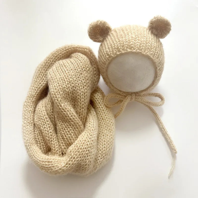 A beige knit bear hat and wrap set for newborn photography.