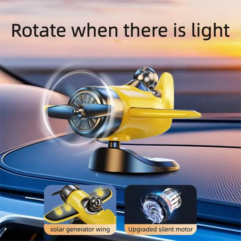 A yellow solar powered rotating airplane dashboard ornament with an upgraded silent motor.