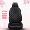 Black leather car seat cushion set with diamond stitching and a padded headrest
