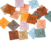 A collection of 20 colorful embossed leather labels for sewing and crafts in various shades of brown, orange, green, and pink