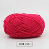 A ball of bright pink pre-dyed milk cotton yarn used for knitting and crochet.