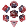 A set of seven polyhedral dice made of glitter resin in various colors and shapes for tabletop role-playing games