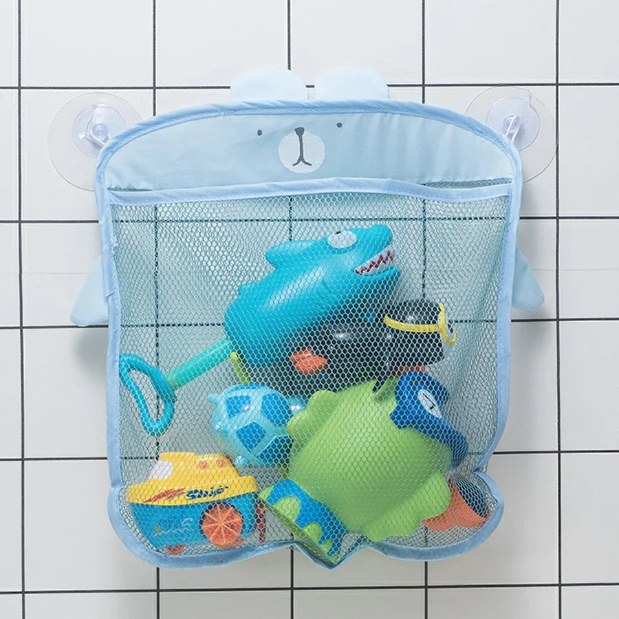 A light blue duck-shaped storage bag with a mesh net holding various toys like a blue frog and a yellow toy.