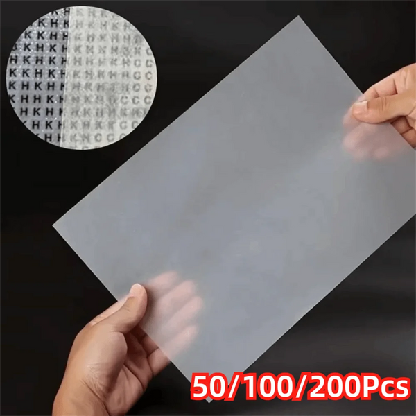A hand holds a sheet of diamond painting release paper with a circular pattern visible on the top section.