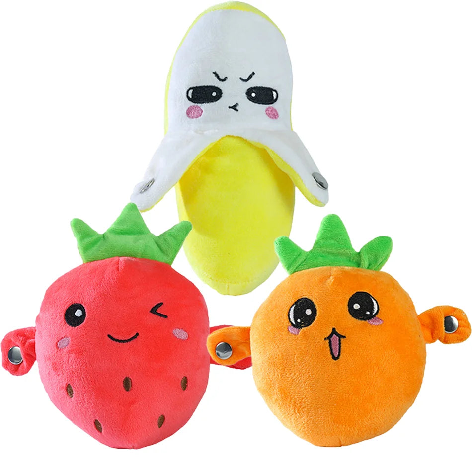 A plush toy shaped like a strawberry and a banana, designed for sensory play.