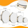 A set of wooden tambourines with metal jingles shown in various sizes and angles for music practice.