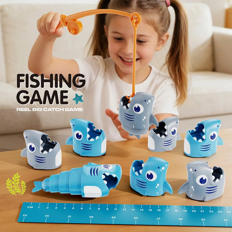 A young girl is playing a fishing game with eight plastic shark toys on a wooden table next to a ruler.