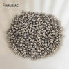 A pile of small, round, silver-colored spacer beads for jewelry making.
