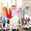 A group of happy children playing with glowing LED hover soccer balls.