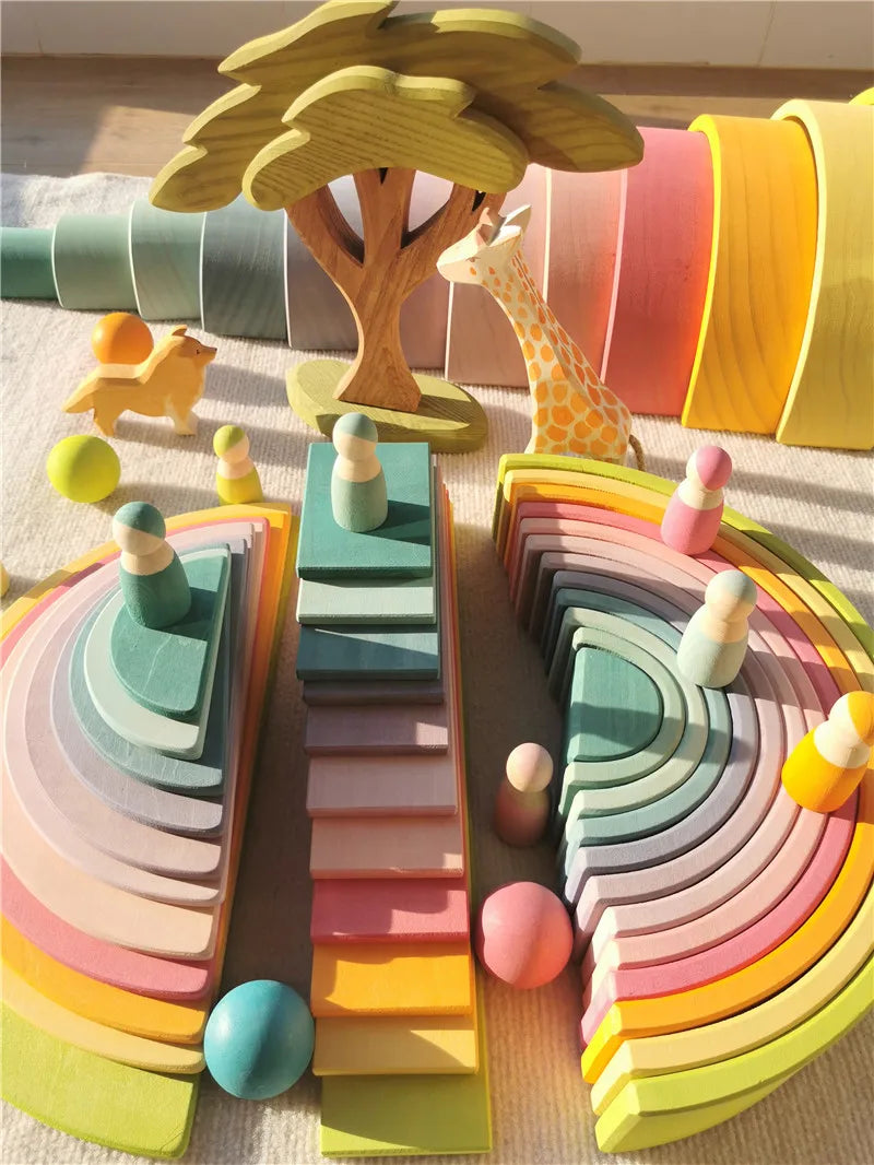 A colorful set of wooden stacking blocks in pastel shades arranged in a fan shape.