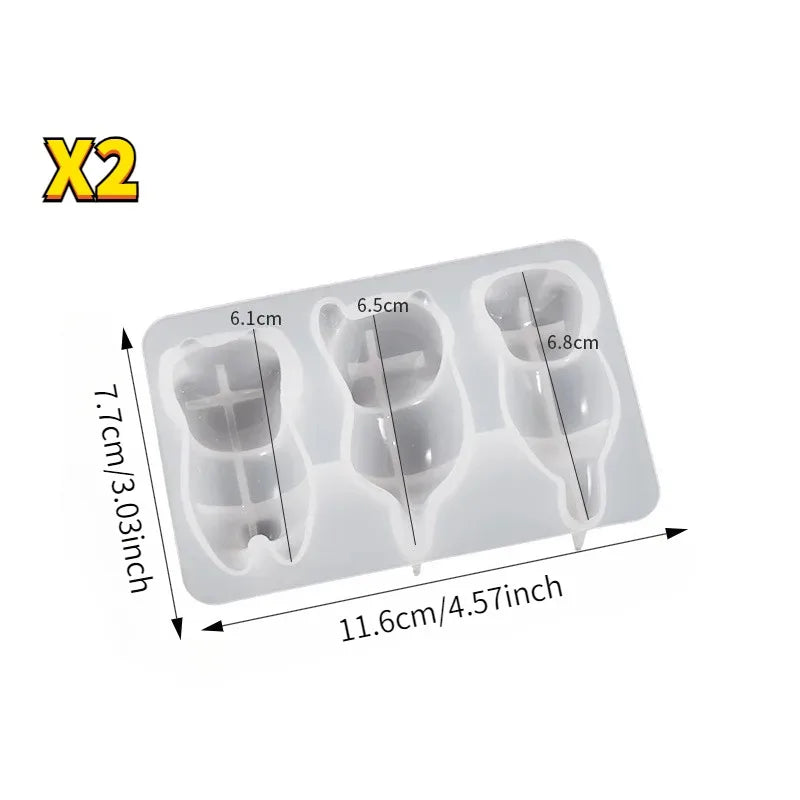 Two white silicone resin molds for making cat-themed keychains, pendants, and pen holders.