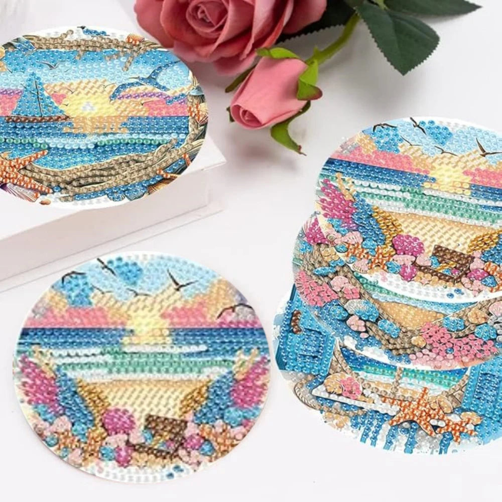 Ein Set farbenfroher Diamantmal-Untersetzer mit floralen und Seesthemen.