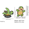 A set of cute green turtle enamel pins featuring a smiling turtle character.