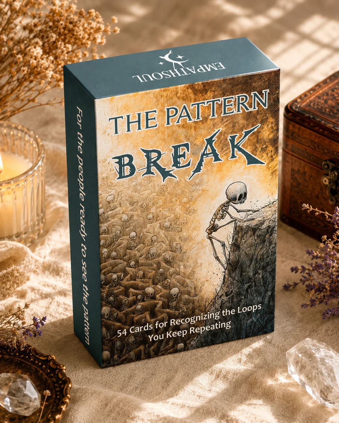 A box of The Pattern Break oracle card deck with a dark green cover featuring a silhouette and text on a textured background.