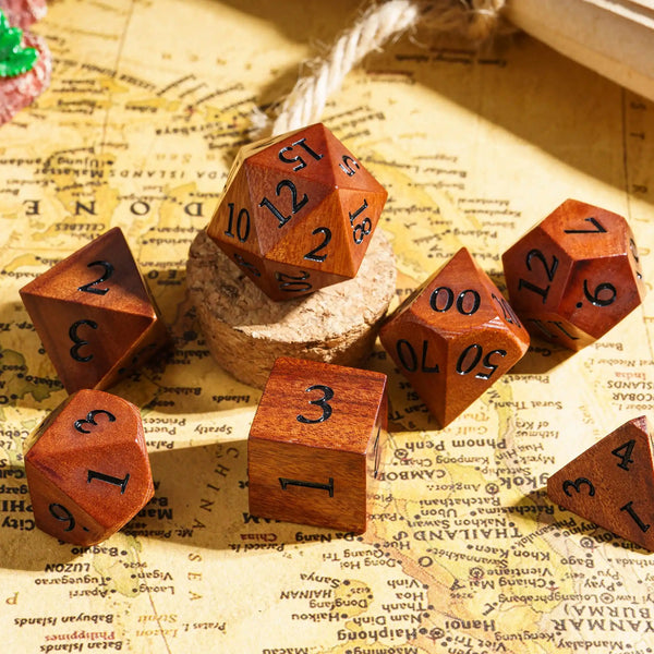 A set of wooden polyhedral dice resting on a map or parchment background.