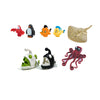 A collection of six African wildlife animal building blocks, including a red bird, black bird, orange bird, yellow bird, and 