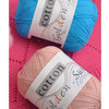 A ball of light blue cotton knitting yarn labeled golden sun.