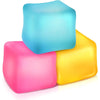 Three colorful squishy stress cubes in pink, light blue, and yellow stacked together.