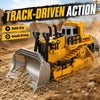 Yellow mini RC construction vehicle excavator with a silver bucket driving on dirt terrain.
