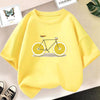 A yellow graphic t-shirt featuring a bicycle design with lemon wheels.