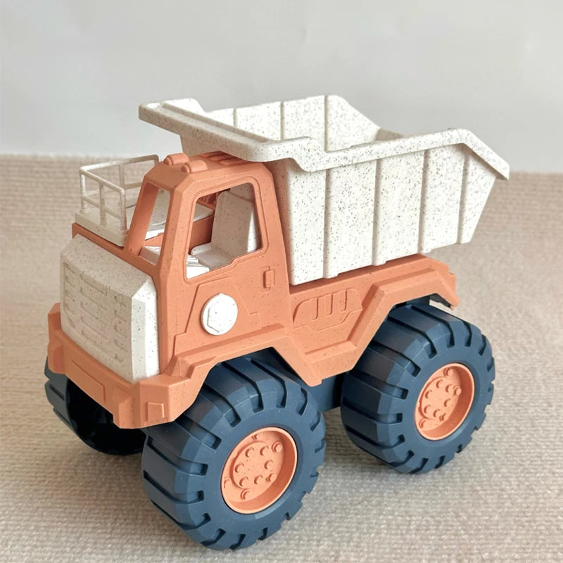 A plastic pull-along bulldozer toy truck with an orange cab and a white dump bed on a light background.
