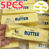 A close-up of several yellow butter sticks packaged in clear plastic bags with branding and weight information.