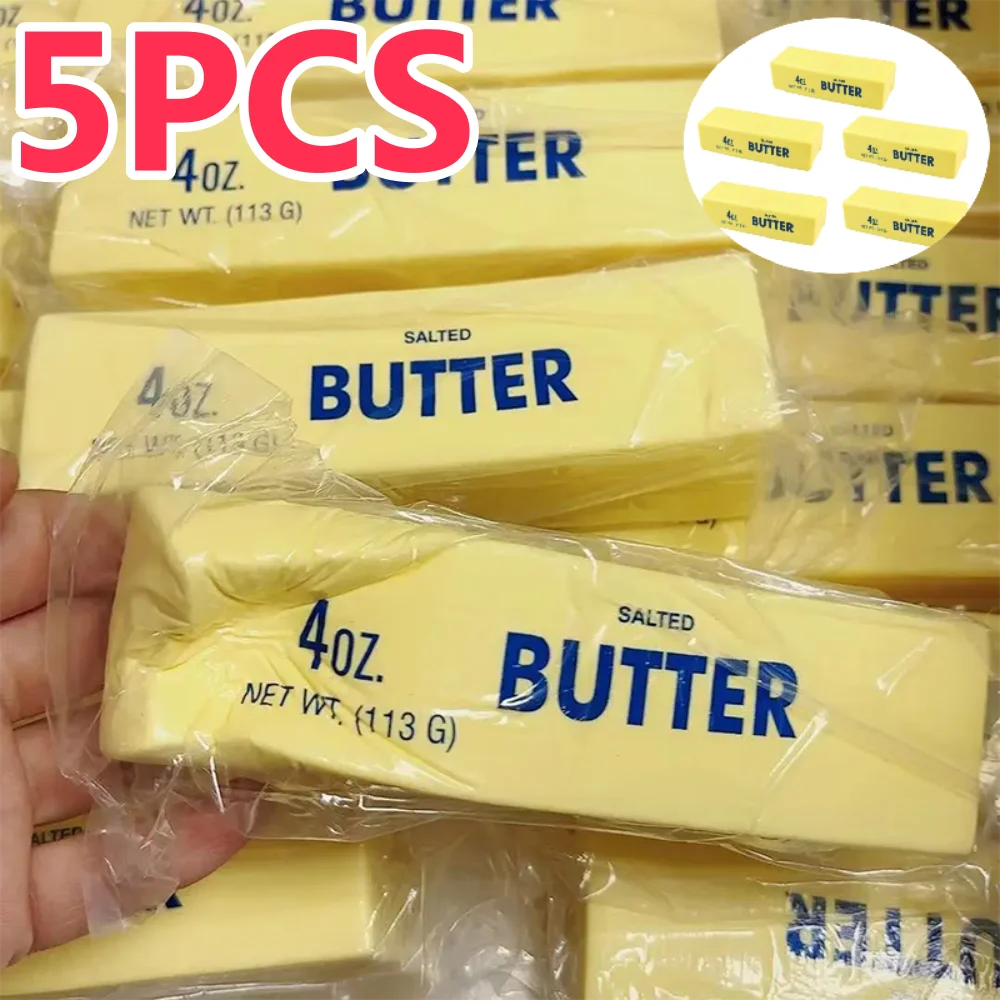 A close-up of several yellow butter sticks packaged in clear plastic bags with branding and weight information.