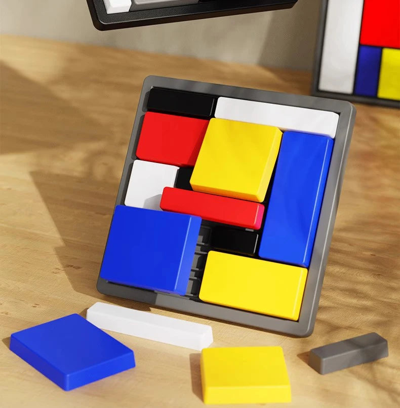 A set of colorful geometric puzzle pieces, including red, yellow, and blue blocks, are displayed on a wooden surface.