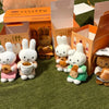 A collection of Miffy Bakery Series plush toys in various colors and outfits displayed in open cardboard boxes.