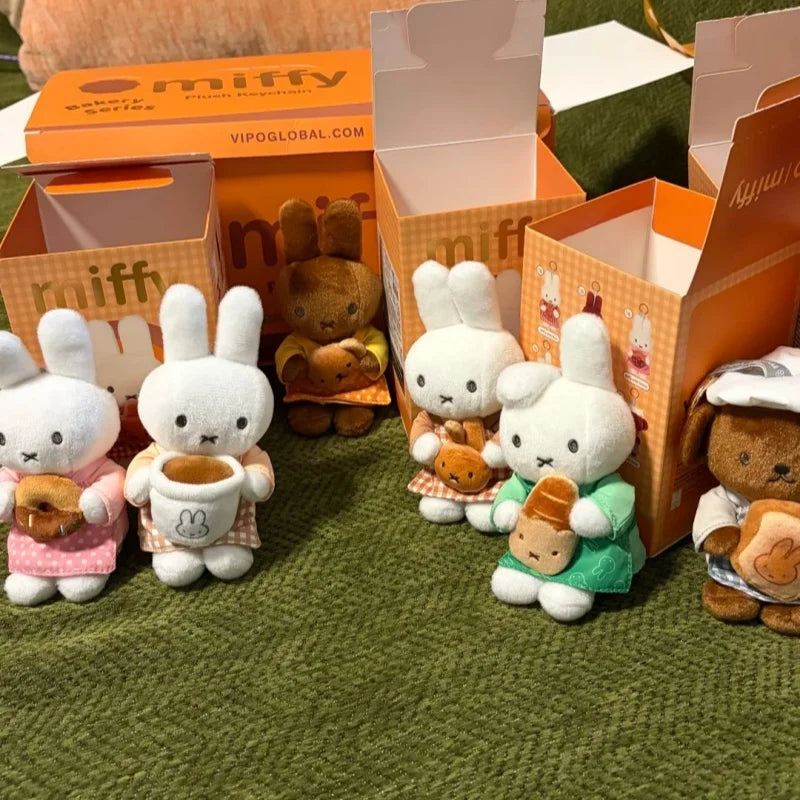 A collection of Miffy Bakery Series plush toys in various colors and outfits displayed in open cardboard boxes.