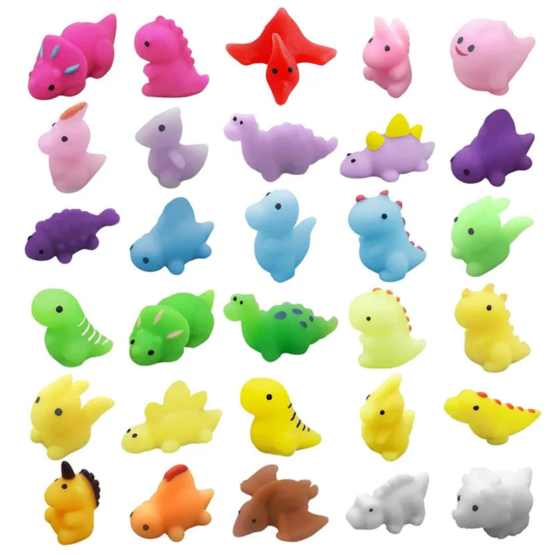 A collection of pink, purple, and green squishy dinosaur fidget toys for sensory stress relief.