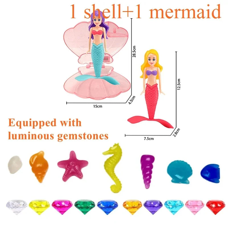 A mermaid dive toy featuring a shell and luminous gemstones, shown with dimensions.