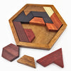 A wooden tangram puzzle set featuring various geometric shapes in shades of brown and reddish wood.