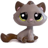 A gray cat bobble head figurine with large green eyes and pink accents.