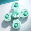 A set of light mint green suction cup spinner bath toys for toddlers, featuring multiple round silicone spinners.